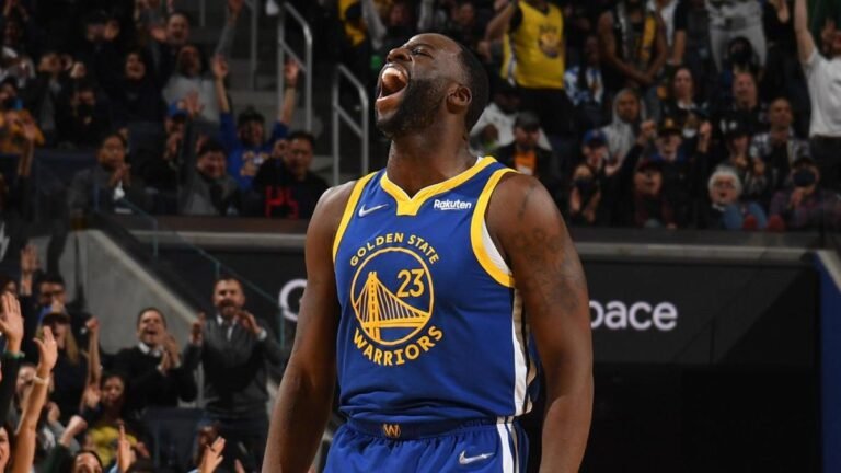 Draymond Jamal Green celebrating during a Golden State Warriors NBA game while leading the team's defense and championship pursuit.